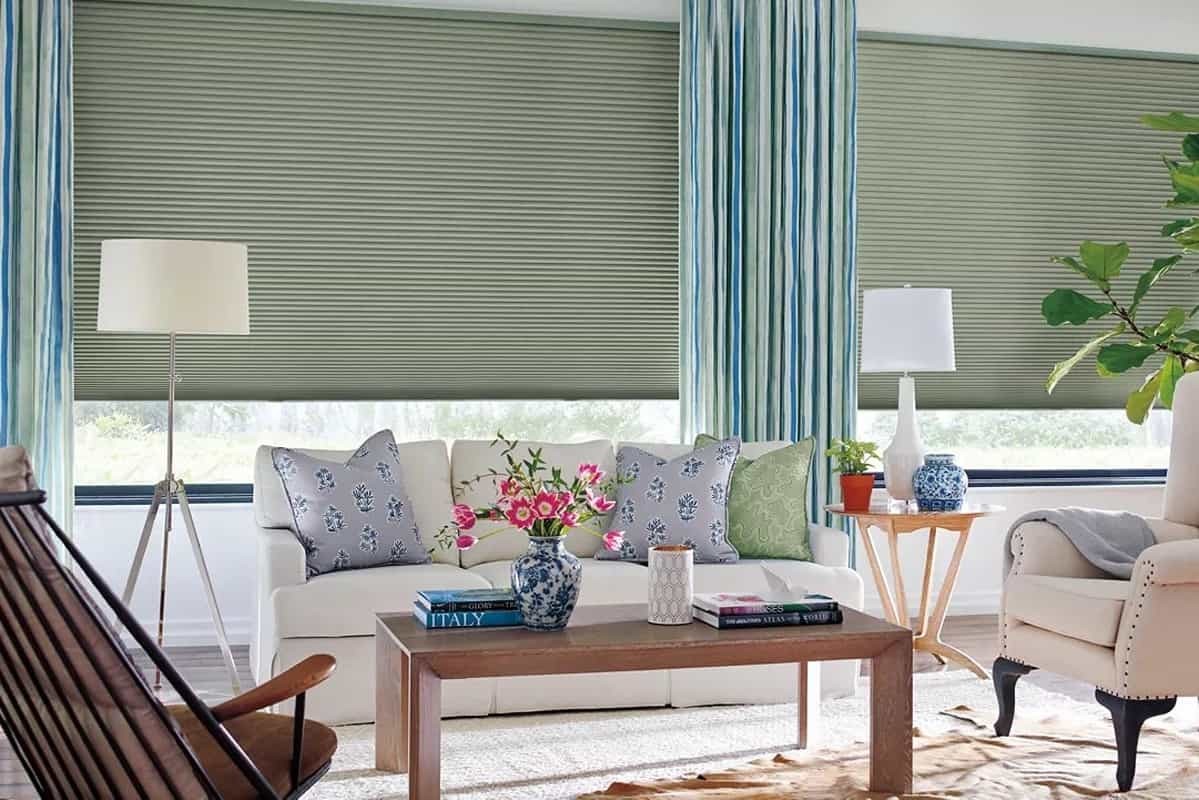 Blue, white and green drapery accenting a living room